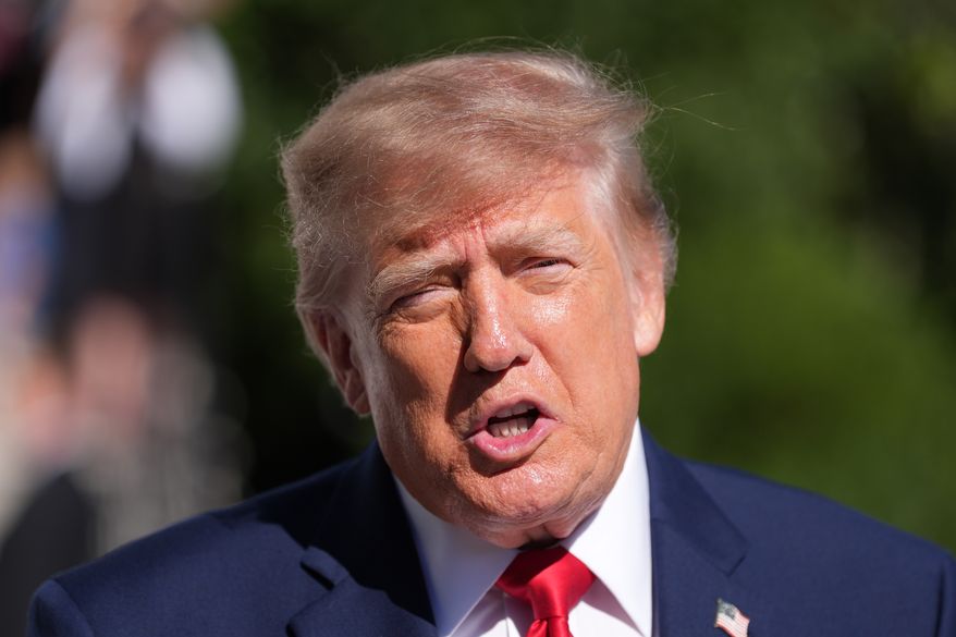 President Donald Trump speaks with reporters before departing on Marine One from the South Lawn of the White House, Tuesday, Oct. 6, 2026, in Washington. (AP Photo/Alex Brandon)