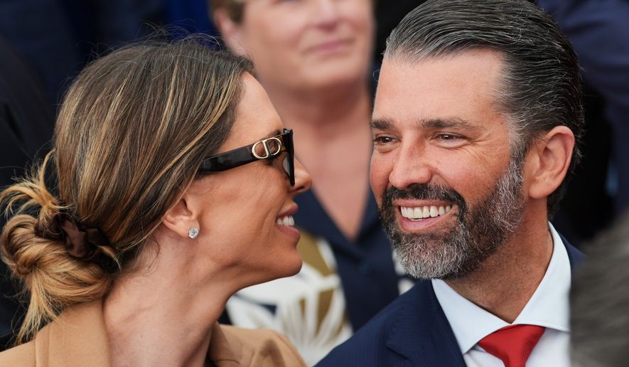 Donald Trump Jr., speaks with his wife Bettina, left, as they wait for President Donald Trump to deliver remarks to U.S. embassy staff at Deerfield Residence in Dublin, Sept. 12, 2026. (AP Photo/Julia Demaree Nikhinson, File)