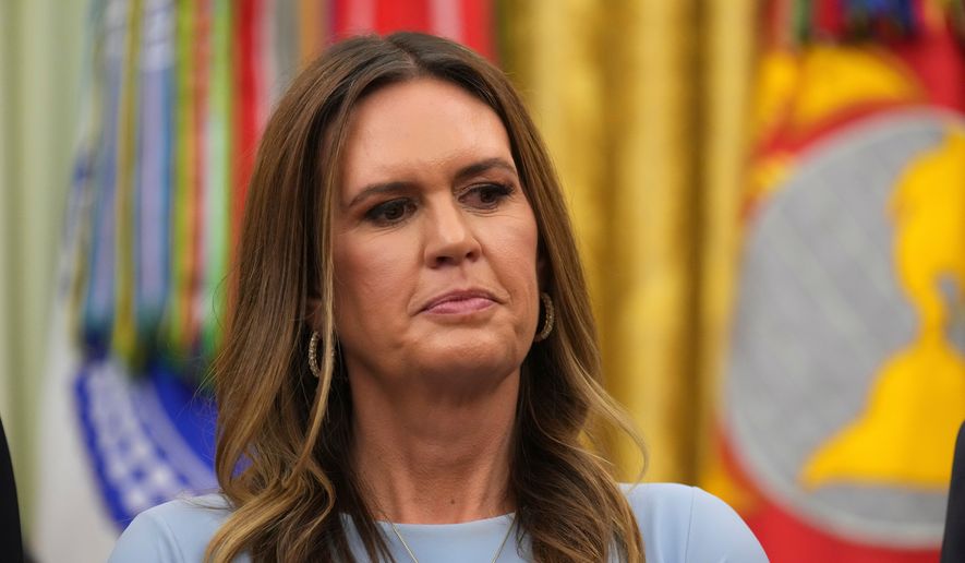 Arkansas Gov. Sarah Huckabee Sanders listens as President Donald Trump speaks during an event about healthcare in the Oval Office of the White House, Friday Sept. 18, 2026, in Washington. (AP Photo/Jacquelyn Martin)