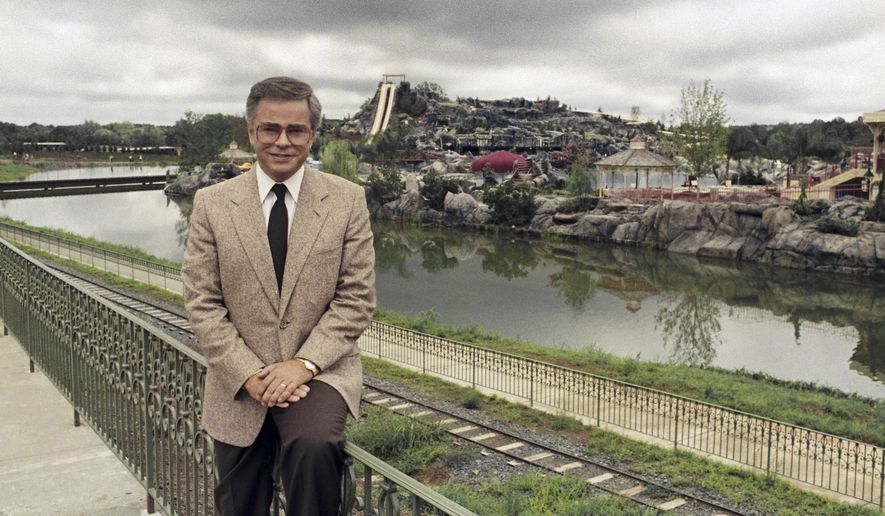 Television evangelist Jim Bakker poses in front of the Water Park in Columbia, SC, one of the attractions at his Heritage USA, on March 19, 1987. (AP Photo/Lou Krasky, File)