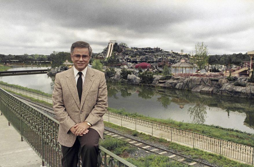 Television evangelist Jim Bakker poses in front of the Water Park in Columbia, SC, one of the attractions at his Heritage USA, on March 19, 1987. (AP Photo/Lou Krasky, File)