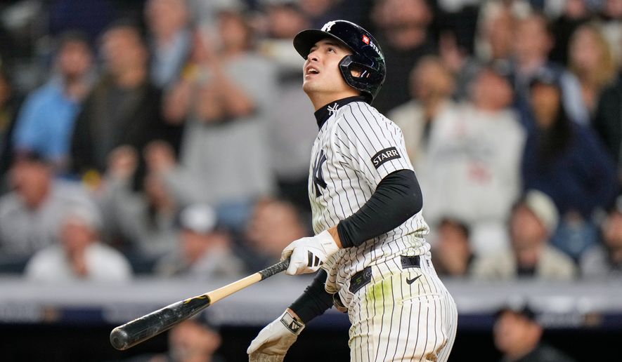 New York Yankees' Anthony Volpe follows through on a run-scoring double after a umpires review during the sixth inning in Game 3 of baseball's American League Division Series against the Tampa Bay Rays, Wednesday, Oct. 7, 2026, in New York. (AP Photo/Seth Wenig)