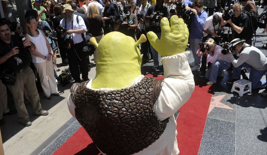 "Shrek" waves to photographers as the character receives a star on the Hollywood Walk of Fame in Los Angeles, Thursday, May 20, 2010. (AP Photo/Chris Pizzello)