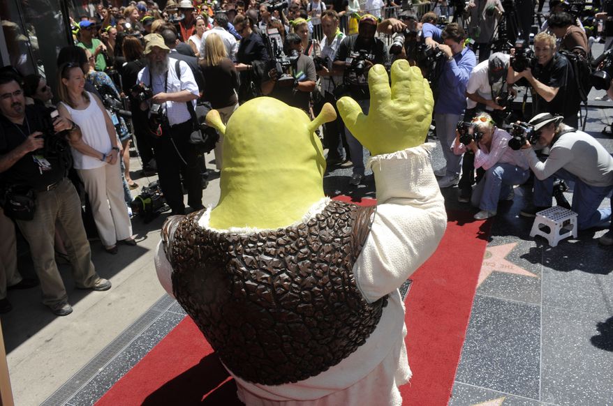 "Shrek" waves to photographers as the character receives a star on the Hollywood Walk of Fame in Los Angeles, Thursday, May 20, 2010. (AP Photo/Chris Pizzello)