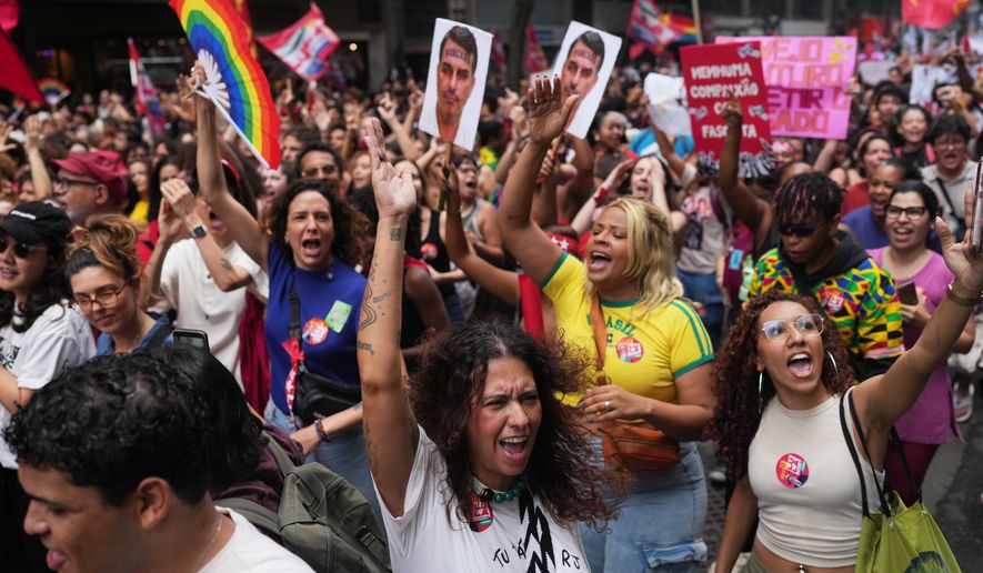 Students march to defend public education and support Brazilian President Luiz Inacio Lula da Silva, who is running for a fourth term, ahead of the presidential runoff election in Rio de Janeiro, Wednesday, Oct. 7, 2026. (AP Photo/Silvia Izquierdo)