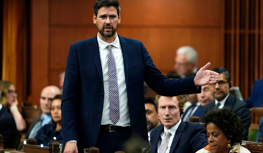 Minister of Justice Sean Fraser rises during Question Period in the House of Commons on Parliament Hill in Ottawa on Wednesday, Oct. 7, 2026. (Justin Tang/The Canadian Press via AP)