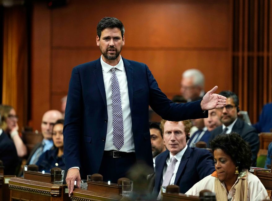 Minister of Justice Sean Fraser rises during Question Period in the House of Commons on Parliament Hill in Ottawa on Wednesday, Oct. 7, 2026. (Justin Tang/The Canadian Press via AP)