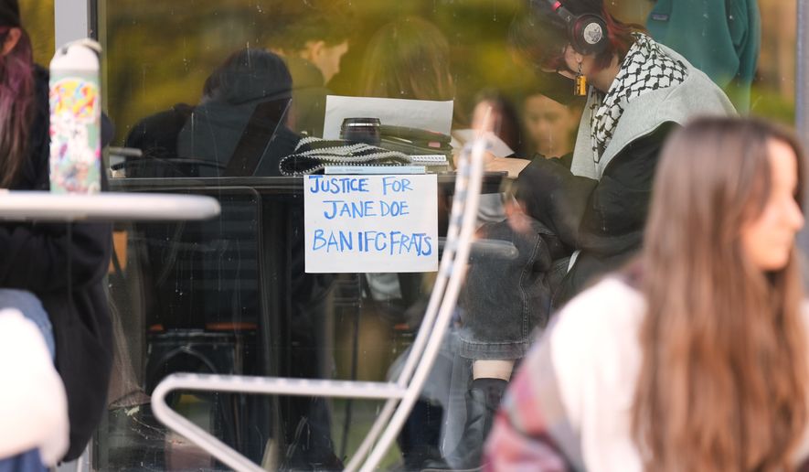 A sign is displayed in support of Jane Doe during a sit-in protest at Cornell University, Wednesday, Oct. 7, 2026, in Ithaca, N.Y. (AP Photo/Matt Burkhartt)