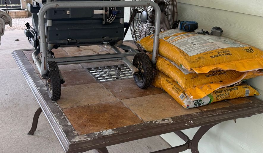 This photo taken with a smartphone and provided by Maranie Adams shows various belongings stored on higher surfaces ahead of the arrival of Tropical Storm Isaias on Wednesday, Oct. 7, 2026, in Gulf Shores, Ala. (Maranie Adams via AP)