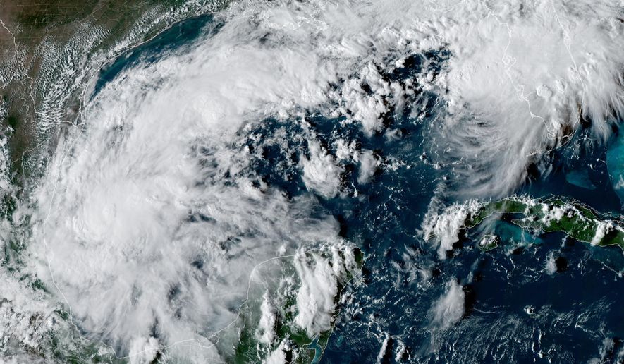 This satellite image from the National Oceanic and Atmospheric Administration shows Tropical Depression Nine forming over the Gulf of Mexico on Tuesday, Oct. 6, 2026. (NOAA via AP)