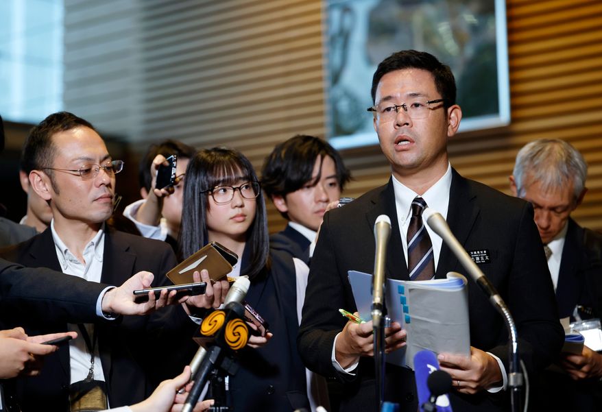Okinawa Gov. Genta Koja speaks to reporters after his meeting with Japanese Prime Minister Sanae Takaichi at the prime minister's office in Tokyo, Japan, Wednesday, Oct.7, 2026. (Franck Robichon/Pool Photo via AP)