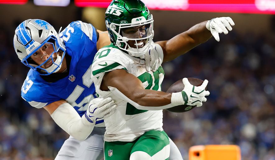Detroit Lions' Trevor Nowaske stops New York Jets' Breece Hall during the second half of an NFL football game in Detroit, Sunday, Sept. 27, 2026. (AP Photo/Rey Del Rio)