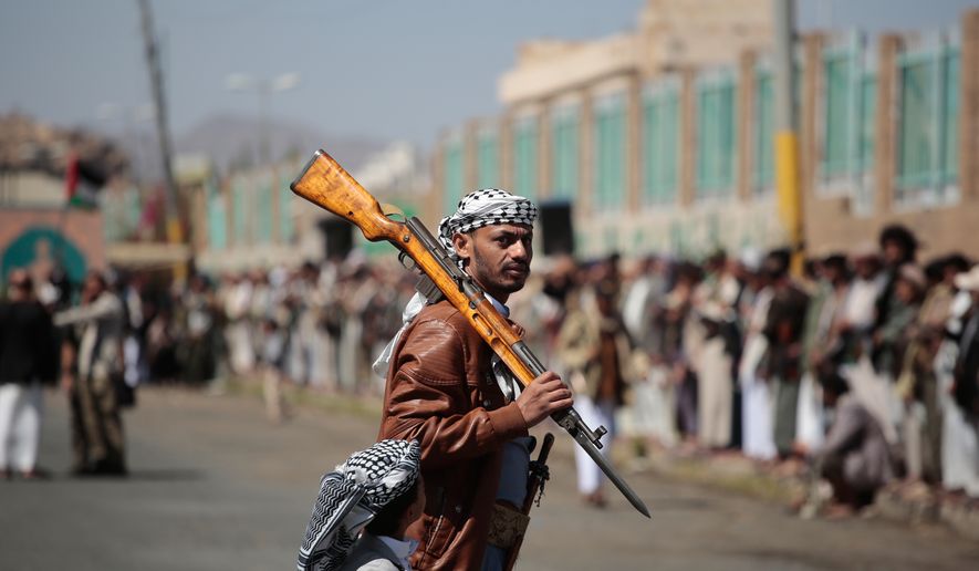 A Houthi supporter carries a rifle while attending an armed tribal rally in Sanaa, Yemen, Wednesday, Oct. 7, 2026. (AP Photo/Osamah Abdulrahman)