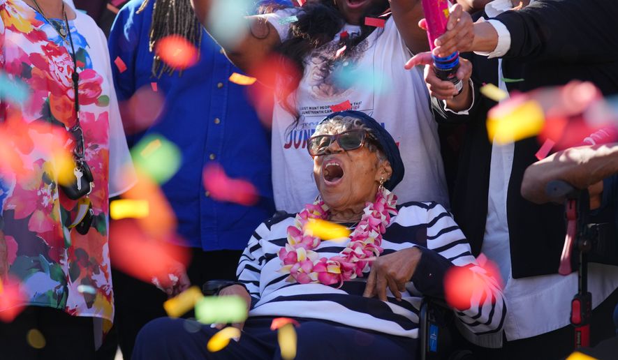 Opal Lee reacts as confetti is popped during an event honoring her 100th birthday Wednesday, Oct. 7, 2026, in Fort Worth, Texas. (AP Photo/Julio Cortez)