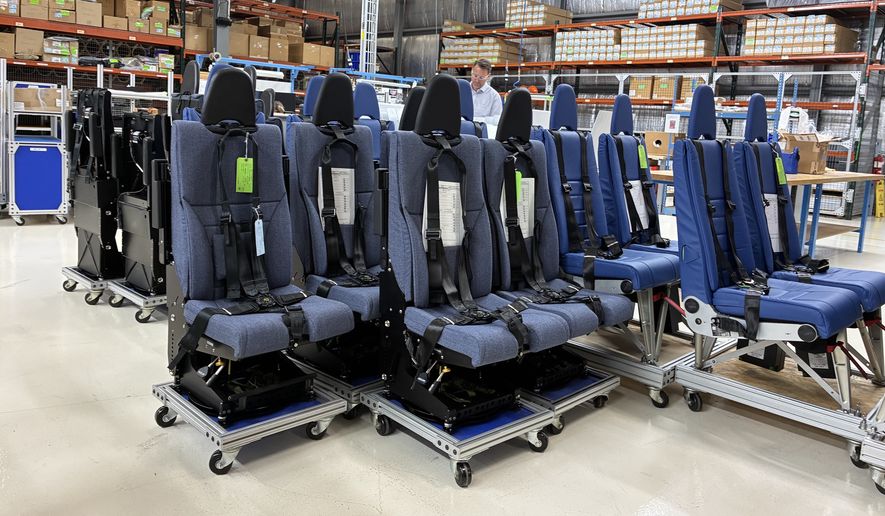 Crashworthy seats for U.S. military helicopters sit on the floor of the Martin-Baker America facility in Johnstown, Pennsylvania. (The Washington Times)