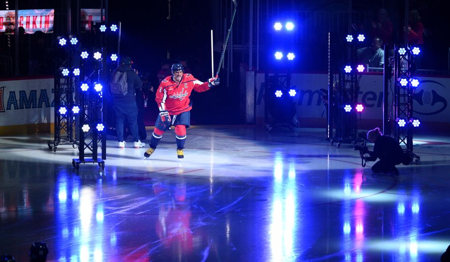 Washington Capitals left wing Alex Ovechkin (8) takes to the ice during player introductions before an NHL hockey game against the Pittsburgh Penguins, Wednesday, Oct. 7, 2026, in Washington. (AP Photo/Nick Wass)