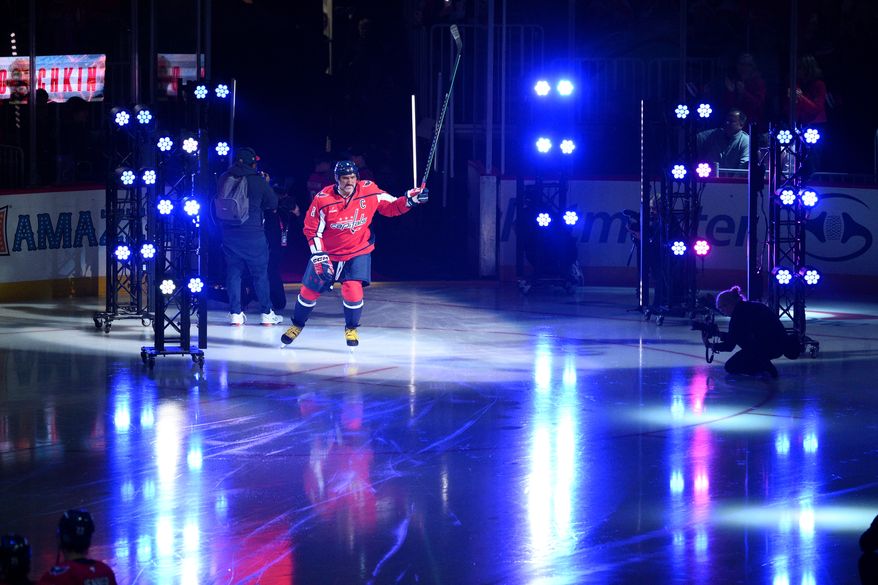 Washington Capitals left wing Alex Ovechkin (8) takes to the ice during player introductions before an NHL hockey game against the Pittsburgh Penguins, Wednesday, Oct. 7, 2026, in Washington. (AP Photo/Nick Wass)