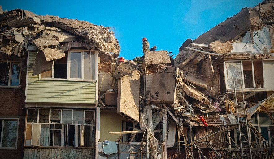 In this photo provided by the Ukrainian Emergency Service, rescuers work on the scene of a building destroyed following recent Russian attacks in Pryluky, Chernihiv region, Ukraine, Wednesday, Oct. 7, 2026. (Ukrainian Emergency Service via AP )