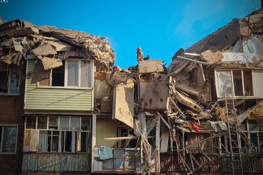 In this photo provided by the Ukrainian Emergency Service, rescuers work on the scene of a building destroyed following recent Russian attacks in Pryluky, Chernihiv region, Ukraine, Wednesday, Oct. 7, 2026. (Ukrainian Emergency Service via AP )