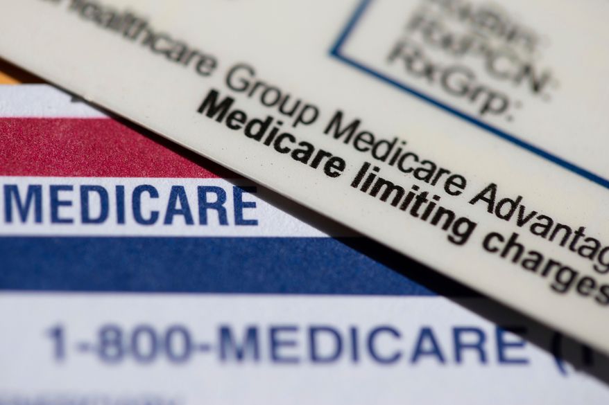 FILE - A Medicare Advantage PPO card rests on top of a Medicare card in Portland, Ore., June 10, 2024. (AP Photo/Jenny Kane, File)