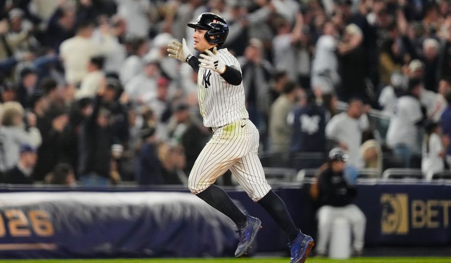 New York Yankees' Anthony Volpe celebrates his run-scoring double during the sixth nning in Game 3 of baseball's American League Division Series against the Tampa Bay Rays, Wednesday, Oct. 7, 2026, in New York. (AP Photo/Yuki Iwamura)
