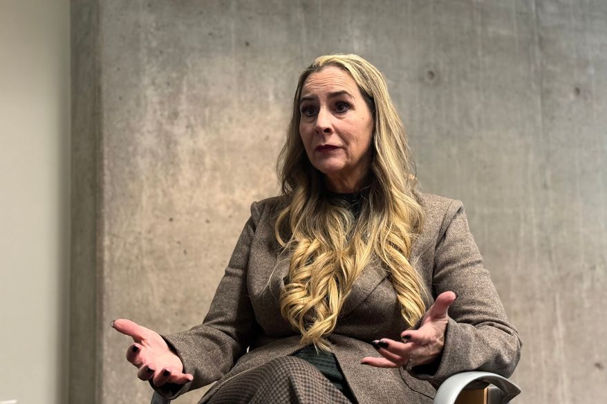 This photo made with a smartphone shows Bernadette Greene-Placentia, who is running for congress in Arizona's 8th Congressional District speaking during an interview with The Associated Press in Phoenix, Thursday, Oct. 8, 2026. (AP Photo/Wufei Yu)