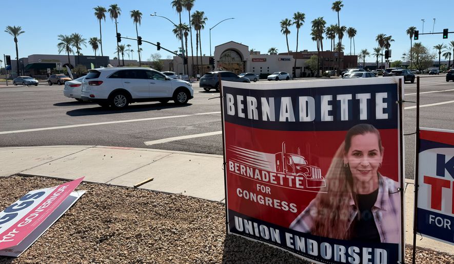 In this photo taken with a smartphone, a signboard of Democratic congressional candidate Bernadette Greene-Placentia is seen Wednesday, Oct. 7, 2026, at an intersection in Sun City, Ariz. (AP Photo/Mikella Schuettler)