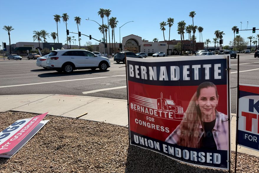 In this photo taken with a smartphone, a signboard of Democratic congressional candidate Bernadette Greene-Placentia is seen Wednesday, Oct. 7, 2026, at an intersection in Sun City, Ariz. (AP Photo/Mikella Schuettler)