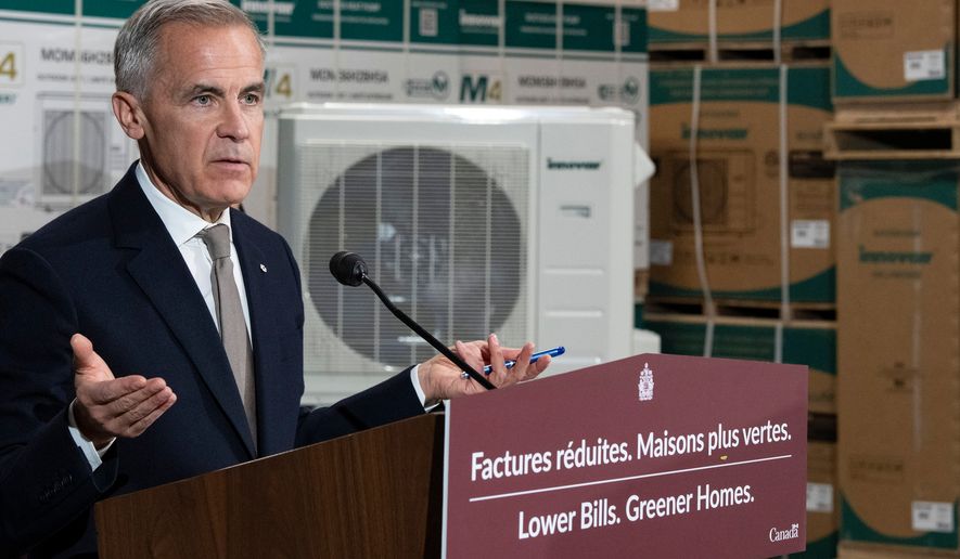 Prime Minister Mark Carney announces a new federal heat pump rebate program while visiting Dettson, a manufacturer of residential and commercial HVAC systems in Sherbrooke, Quebec, Thursday, Oct. 8, 2026. (Christinne Muschi/The Canadian Press via AP)