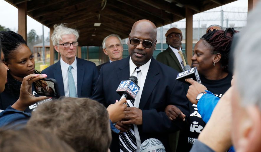 FILE - Curtis Flowers speaks with reporters as he exits the Winston-Choctaw Regional Correctional Facility in Louisville, Miss., Monday, Dec. 16, 2019. (AP Photo/Rogelio V. Solis, File)