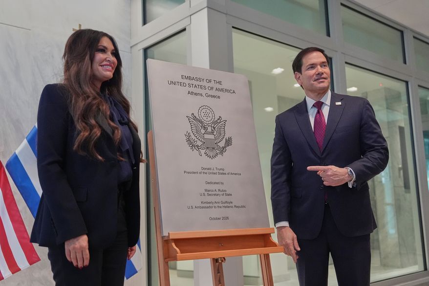 U.S. Secretary of State Marco Rubio right, and U.S. Ambassador to Greece Kimberly Guilfoyle unveil a plaque during a dedication ceremony at the chancery of the U.S. Embassy, Wednesday, Oct. 7, 2026, in Athens, Greece. (AP Photo/Mark Schiefelbein, Pool)