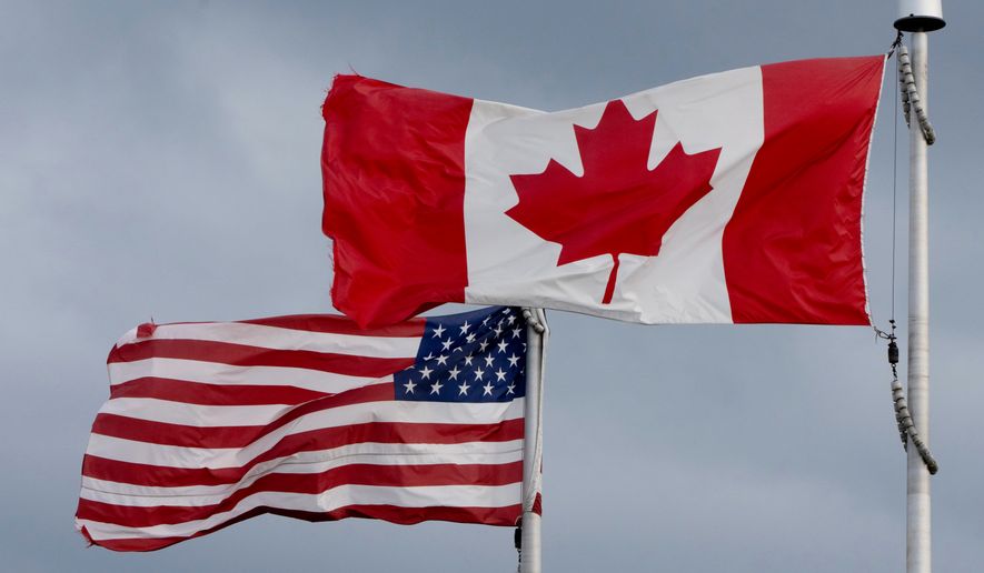 The flags of Canada and the United States fly in Ottawa, Sept. 12, 2026. (Adrian Wyld/The Canadian Press via AP, File)