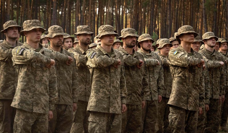 Newly recruited soldiers of Ukraine's 3rd Assault Brigade shout slogans at a military base close to Kyiv, Ukraine, on Monday, Sept. 25, 2023. (AP Photo/Efrem Lukatsky) **FILE**