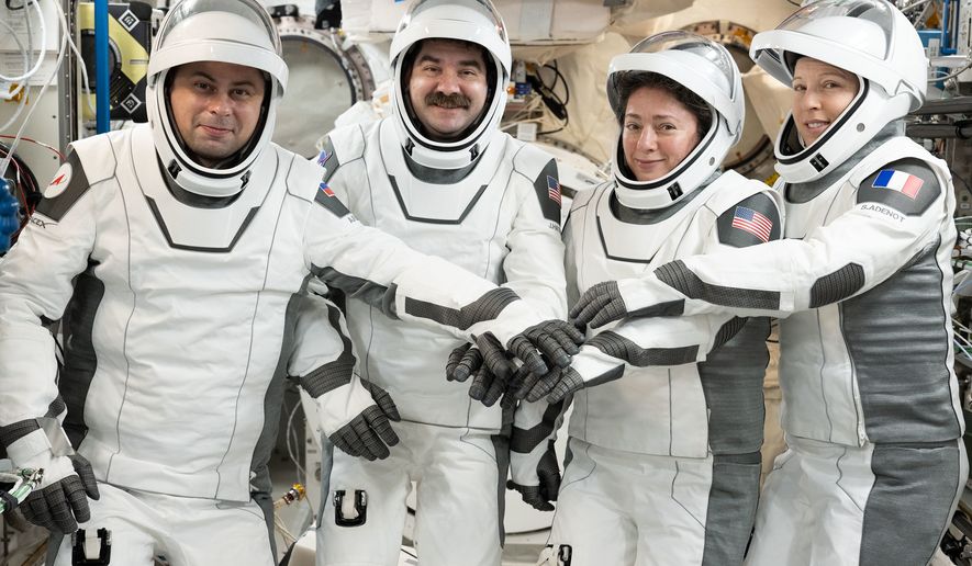 This image provided by NASA on Tuesday Oct. 6, 2026, SpaceX Crew-12 members, from left, Roscosmos cosmonaut and mission specialist Andrey Fedyaev, NASA astronauts Jack Hathaway and Jessica Meir, Crew-12 pilot and commander respectively, and ESA (European Space Agency) astronaut and mission specialist Sophie Adenot, gather for a portrait in the pressure suits they will wear when they depart the International Space Station inside the SpaceX Dragon spacecraft. (Anil Menon/NASA via AP)