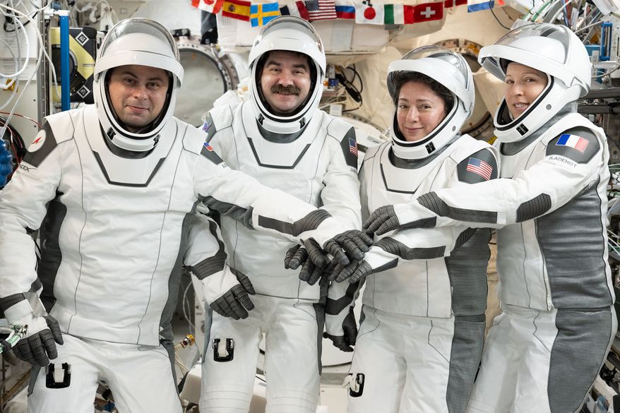 This image provided by NASA on Tuesday Oct. 6, 2026, SpaceX Crew-12 members, from left, Roscosmos cosmonaut and mission specialist Andrey Fedyaev, NASA astronauts Jack Hathaway and Jessica Meir, Crew-12 pilot and commander respectively, and ESA (European Space Agency) astronaut and mission specialist Sophie Adenot, gather for a portrait in the pressure suits they will wear when they depart the International Space Station inside the SpaceX Dragon spacecraft. (Anil Menon/NASA via AP)