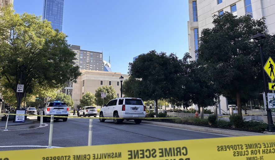 In this photo taken with a smartphone, law enforcement responds to a shooting at the federal courthouse, Thursday, Oct. 8, 2026, in Nashville, Tenn. (AP Photo/Kristin Hall)