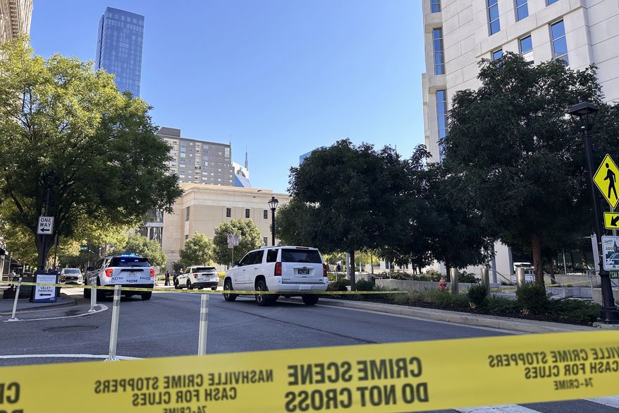 In this photo taken with a smartphone, law enforcement responds to a shooting at the federal courthouse, Thursday, Oct. 8, 2026, in Nashville, Tenn. (AP Photo/Kristin Hall)