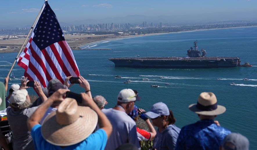 The USS Abraham Lincoln aircraft carrier returns to the San Diego Bay after deployment Thursday, Oct. 8, 2026, in San Diego. (AP Photo/Jae C. Hong)