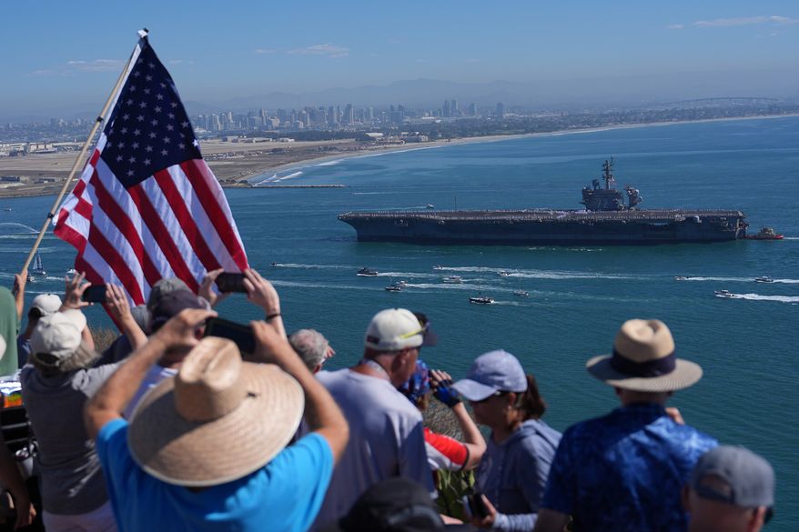 The USS Abraham Lincoln aircraft carrier returns to the San Diego Bay after deployment Thursday, Oct. 8, 2026, in San Diego. (AP Photo/Jae C. Hong)