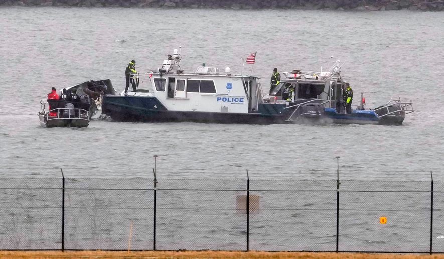 Search efforts are seen around a wreckage site of a deadly midair collision between an American Airlines jet and an Army helicopter in the Potomac River near Ronald Reagan Washington National Airport, Jan. 31, 2025, in Arlington, Va. (AP Photo/Alex Brandon, File)