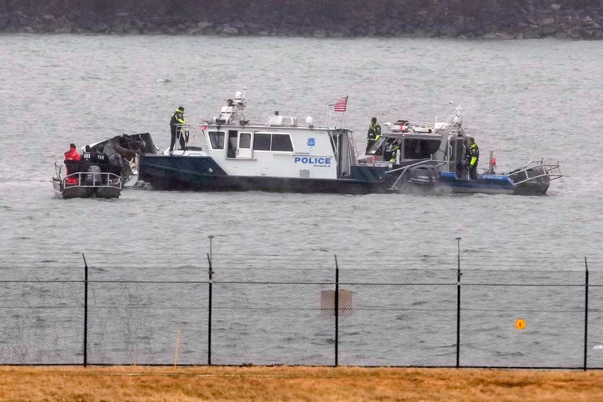 Search efforts are seen around a wreckage site of a deadly midair collision between an American Airlines jet and an Army helicopter in the Potomac River near Ronald Reagan Washington National Airport, Jan. 31, 2025, in Arlington, Va. (AP Photo/Alex Brandon, File)