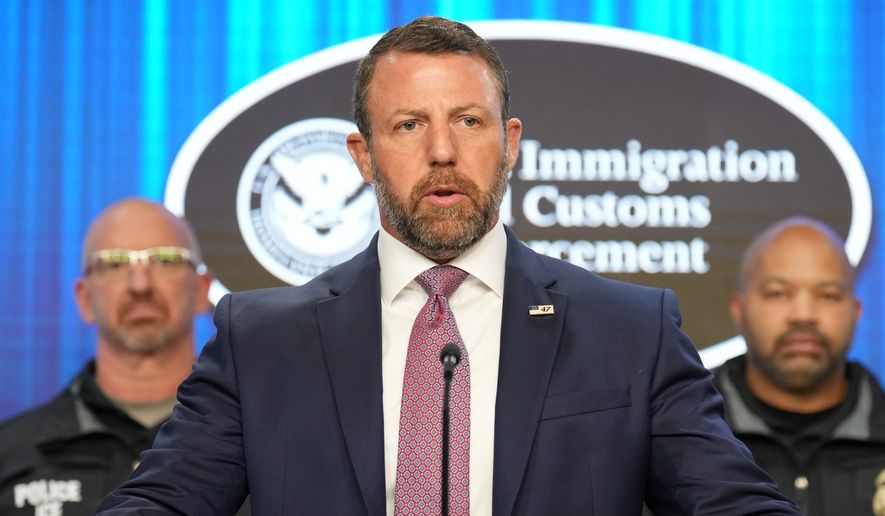 Secretary of Homeland Security Markwayne Mullin, with Immigration and Customs Enforcement (ICE) officials, speaks during a news conference at ICE Headquarters, Friday, Oct. 9, 2026, in Washington. (AP Photo/Jacquelyn Martin)