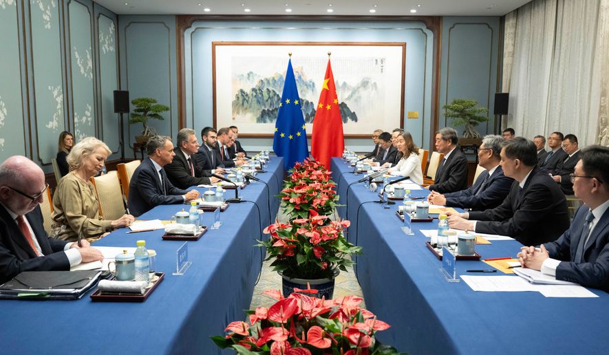 In this photo released by the Xinhua News Agency, Chinese Vice Premier He Lifeng, fourth right, meets with European Commissioner for Trade and Economic Security Maros Sefcovic, fourth left, in Beijing, Friday, Oct. 9, 2026. (Tian Yu/Xinhua via AP)