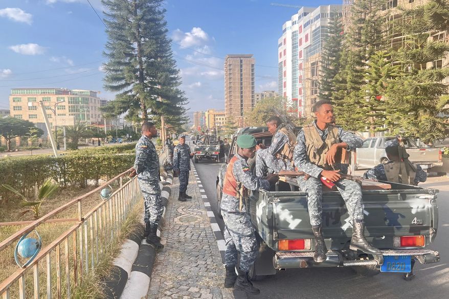 In this photo taken with a smartphone, Ethiopian federal police officers gather on a road in Mekelle, Tigray Region, Ethiopia, Thursday, Oct. 8, 2026. (AP Photo/Filmon Equar Hailu)
