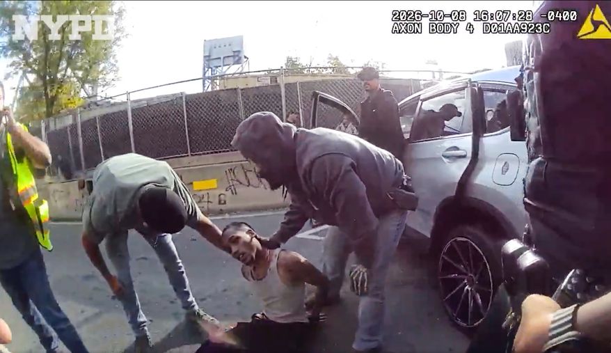 In this image taken from police-worn body camera video released the New York City Police Department (NYPD), law enforcement personnel tend to a Oscar Belgal, 28, a Dominican man who was shot by Federal immigration officers, Thursday, Oct. 8, 2026, in New York, as he drove his car with a 5-year-old boy inside. (NYPD via AP)