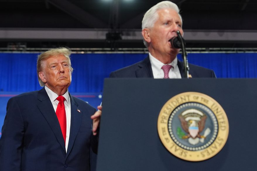 President Donald Trump listens as New York Republican gubernatorial candidate Bruce Blakeman speaks at a campaign rally at the Oncenter, Friday, Oct. 9, 2026, in Syracuse, N.Y. (AP Photo/Julia Demaree Nikhinson)
