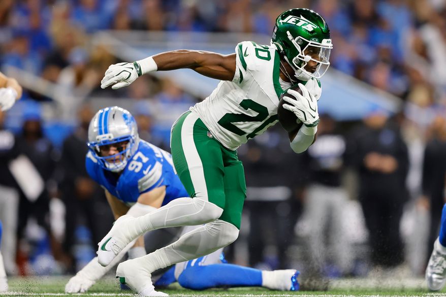 New York Jets' Breece Hall runs during the first half of an NFL football game against the Detroit Lions in Detroit, Sunday, Sept. 27, 2026. (AP Photo/Rey Del Rio)