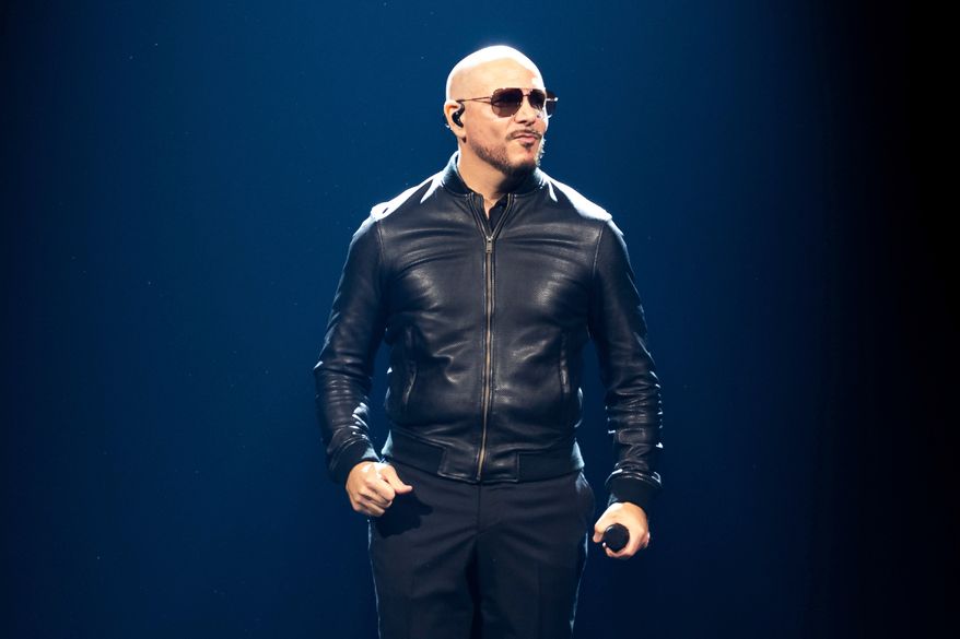 FILE - Pitbull performs in concert in London on June 9, 2025. (Photo by Scott A Garfitt/Invision/AP, File)