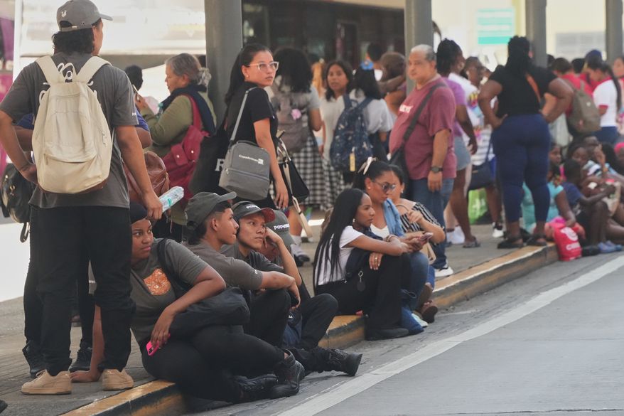 People gather outside shopping mall after an earthquake hit Panama City, Friday, Oct. 9, 2026. (AP Photo/Aris Mariota)