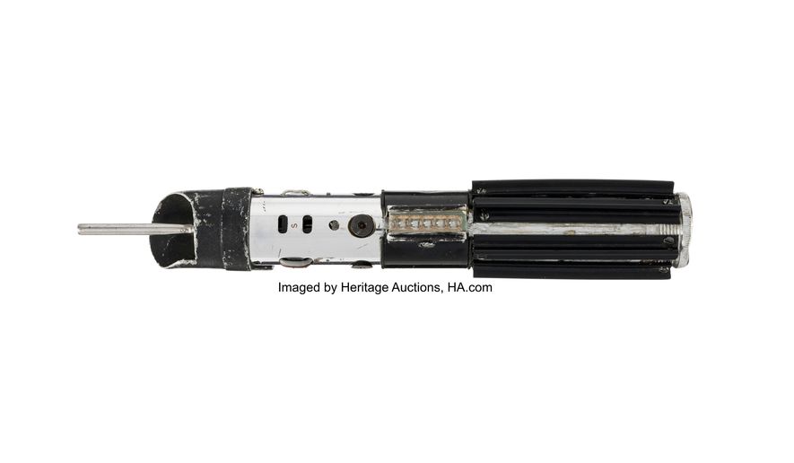 This image released by Heritage Auctions shows a lightsaber used by the character Darth Vader used in the film "The Empire Strikes Back." (Heritage Auctions via AP)